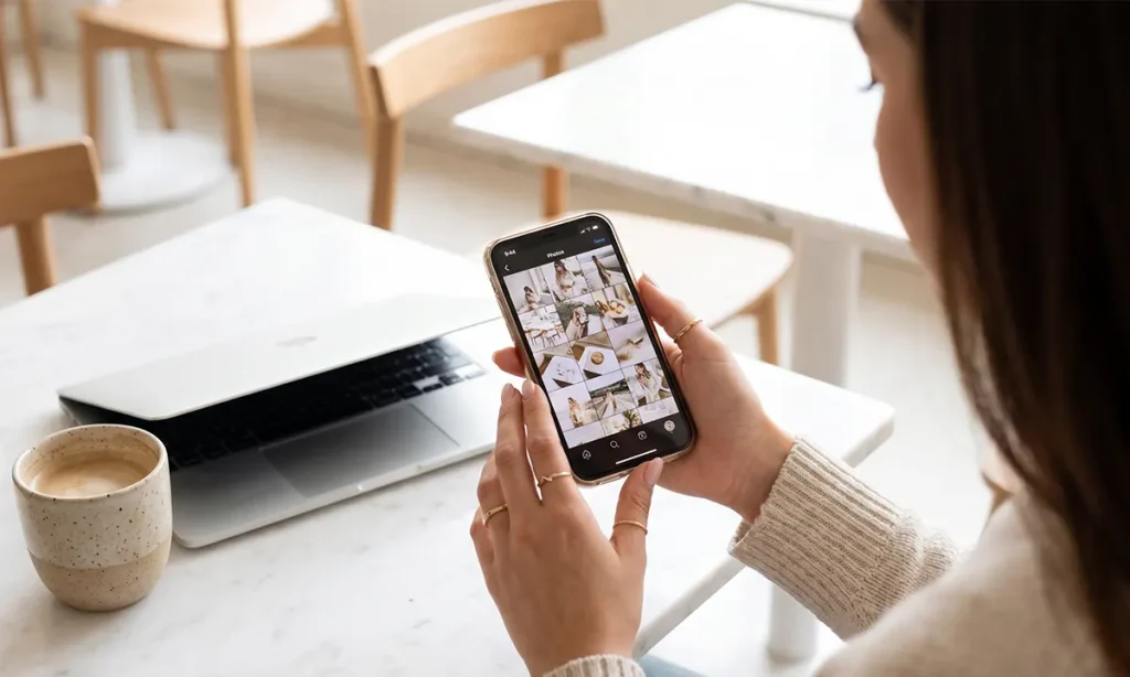 Female entrepreneur using a smartphone to edit aesthetic photos for a social media app.