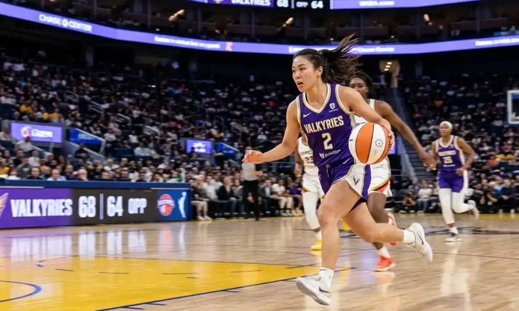 Kaitlyn Chen driving against defenders in a WNBA game